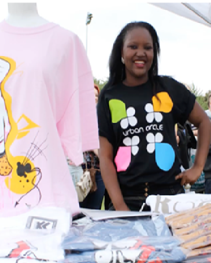 A picture of some volunteers manning a merch stall during Pill Carnival
